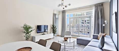 Burj Views B L242 | Living area | 50-inch flat-screen TV with cable channels