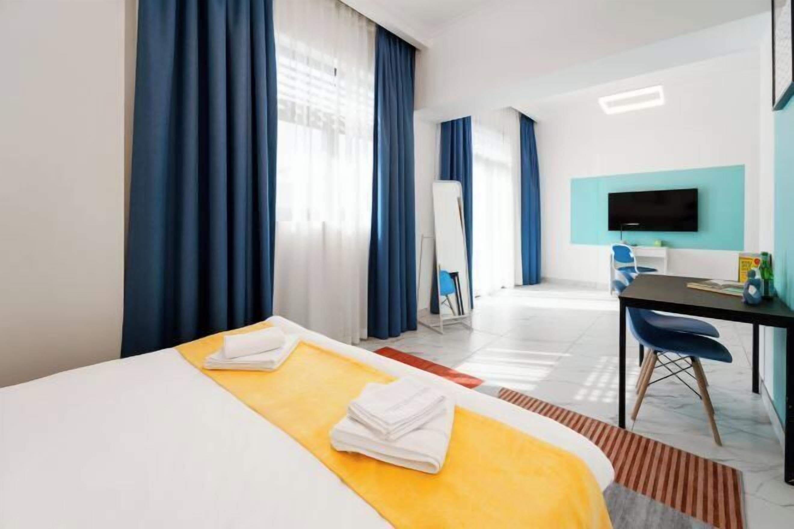 In-room safe, desk, laptop workspace, blackout curtains