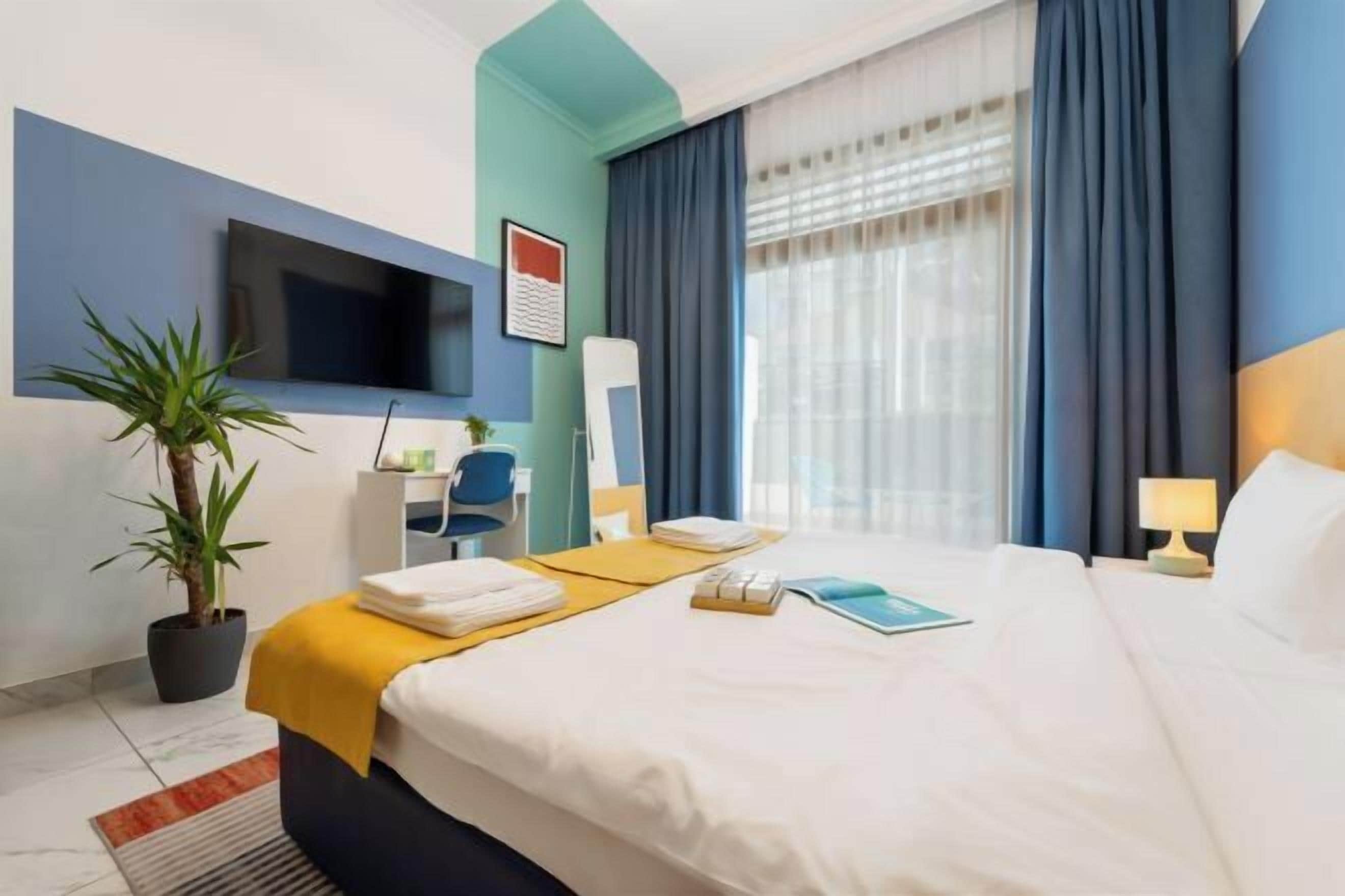 In-room safe, desk, laptop workspace, blackout curtains