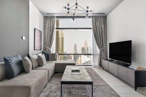 Deluxe Apartment | Living area | 43-inch flat-screen TV with cable channels - Silkhaus Index Tower, DIFC Dubai (Dubai)