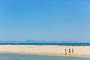 Beach nearby, white sand, 3 beach bars