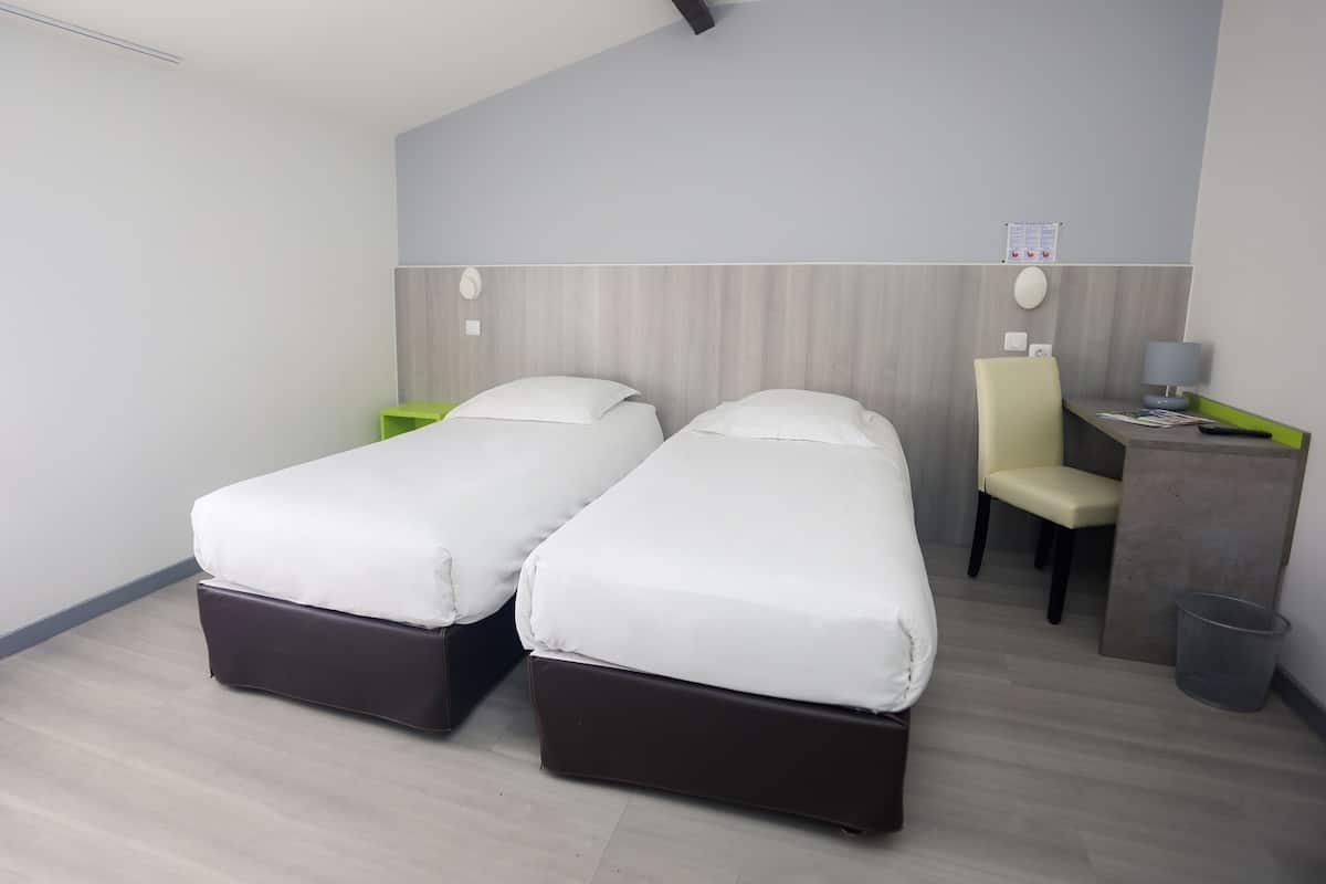 Twin Room | Desk, blackout drapes, free WiFi, bed sheets