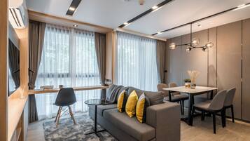 One Bed Room with Bathtub | Living area | 43-inch Smart TV with digital channels