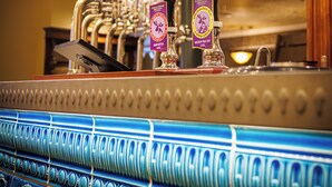 A bar area with multiple taps labeled with beer names and percentages. - The Fanny Talbot  (Barmouth)