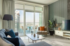 Classic Apartment | Living area | 43-inch flat-screen TV with cable channels