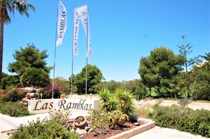 A sign with "Las Ramblas" and two flags.