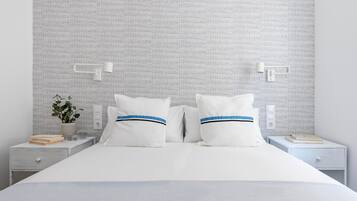 Una cama bien tendida con ropa blanca y dos almohadas, una mesita de noche con un libro y una planta, y una pared con un diseño texturizado.
