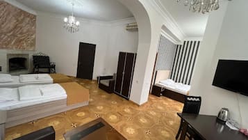 Deluxe Quadruple Room, 2 Bedrooms | In-room safe, blackout drapes, iron/ironing board, free WiFi