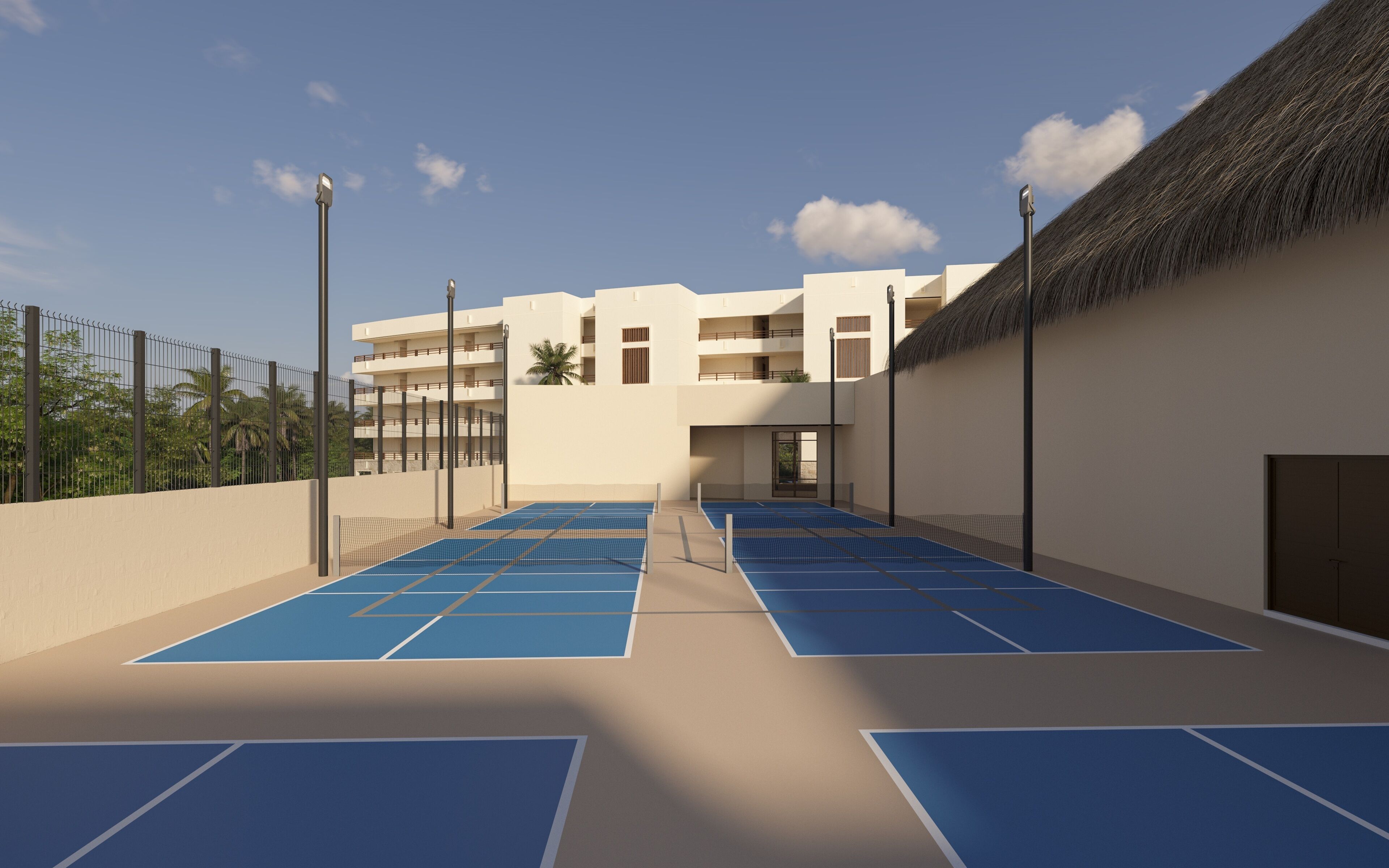 A rooftop tennis court with a building in the background.