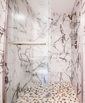 Shower, hair dryer, towels, toilet paper