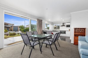Enjoy meals in the dining area with a view of the surrounding neighborhood.