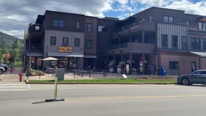A multi-story building with a storefront labeled "HUB".