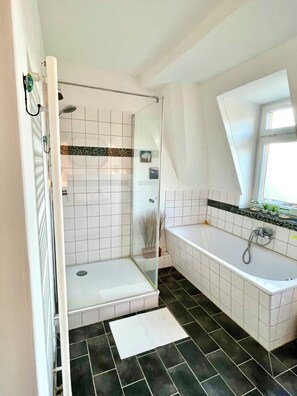 Shower, hair dryer, towels, soap