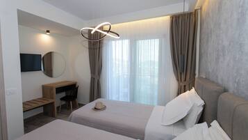 Luxury Villa | Premium bedding, desk, laptop workspace, blackout drapes