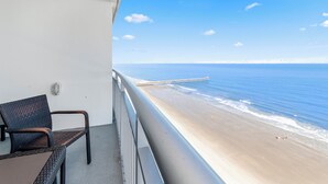 A balcony with a view of the beach and a pier. - Amazing Oceanview Condo on the 17th Fl- 2 Balconies (Myrtle Beach)