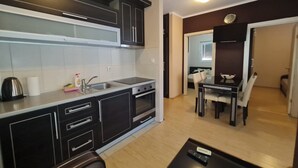 Apartamento família, 2 quartos | Área de estar