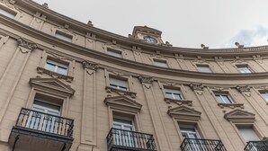 A classical building with ornate architectural details, including columns and decorative moldings. - B48 Bilbao Abando (Bilbao)
