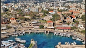 A coastal town with a marina, stone buildings, and a clear view of the surrounding landscape. - Casa del Porto Suite- Intimate private suite (Byblos)