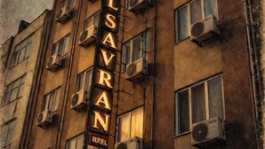 A multi-story building with a prominent sign reading 'HOTEL SAVRAN.' - Savran Otel (Mersin)