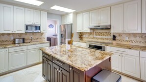 A kitchen with white cabinets, a granite countertop, stainless steel appliances, and a tiled backsplash. - Luxe San Antonio Vacation Rental w/ Private Pool! (San Antonio)