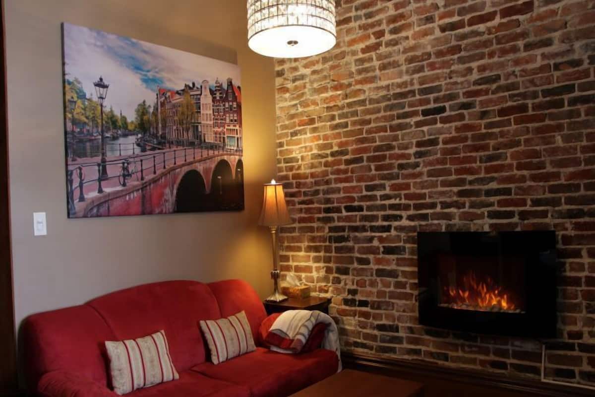 Deluxe Condo, 1 Queen Bed with Sofa bed, Non Smoking, River View | Living area | LED TV, fireplace, Netflix, smart speakers