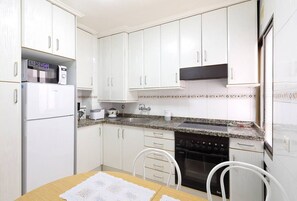 Coffee/tea maker, fridge, microwave, oven