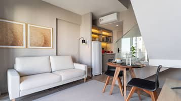 Executive Duplex | Living area | 32-inch Smart TV with digital channels