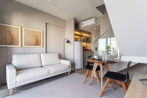 Executive Duplex | Living area | 32-inch Smart TV with digital channels