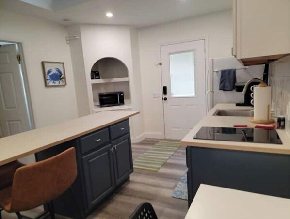 Fridge, microwave, stovetop, coffee/tea maker