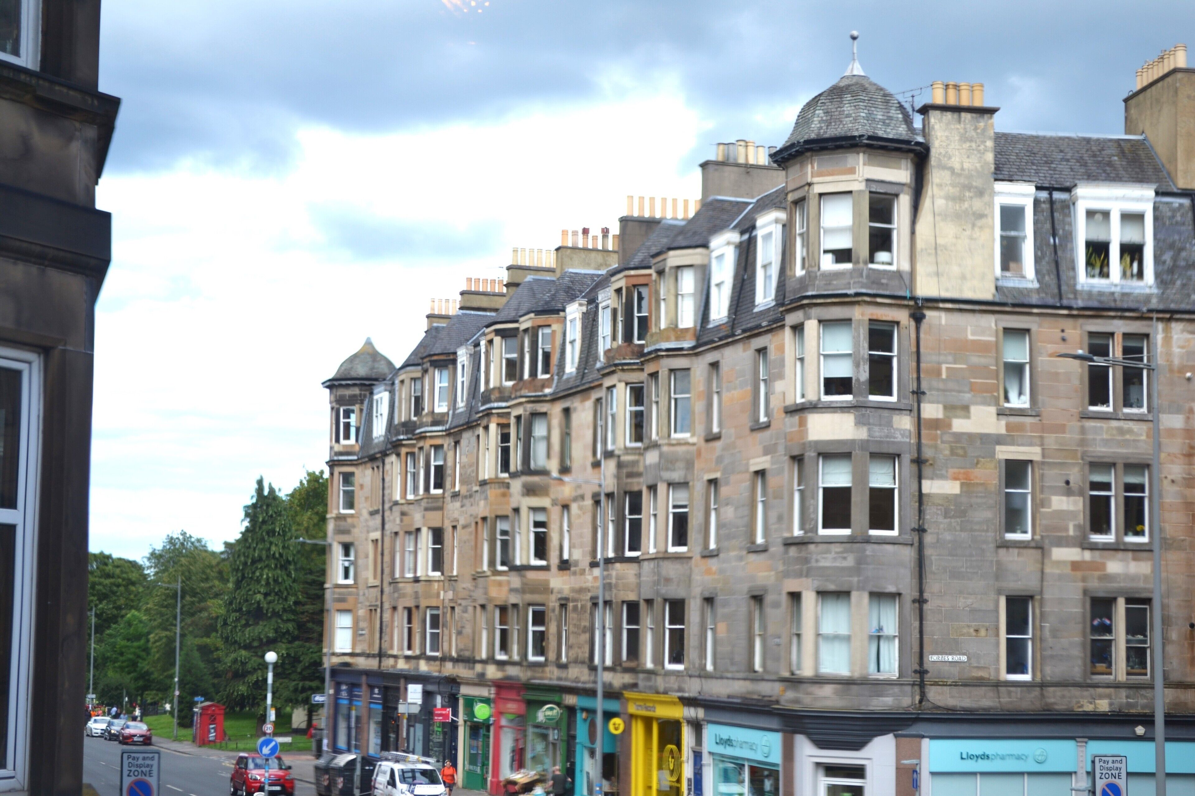 A row of terraced houses with multiple stories, typical of urban residential architecture.