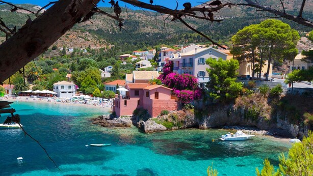 A coastal village with clear turquoise waters, a beach, and colorful buildings. - Impressive Stone Villa, A/C, Private Pool, Sweeping Sea Views to Assos Bay & Magnificent Sunsets! (Defaranata)