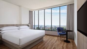 Deluxe Room, 1 King Bed, City View, Corner | Premium bedding, in-room safe, desk, laptop workspace