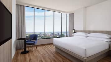 Deluxe Room, 1 King Bed, City View, Corner | Premium bedding, in-room safe, desk, laptop workspace