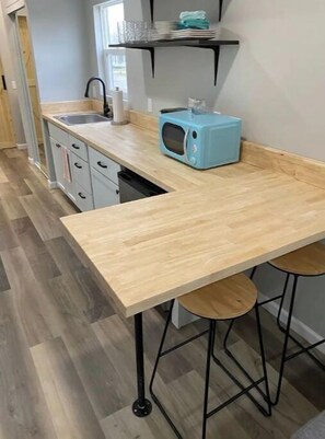 Fridge, microwave, stovetop, coffee/tea maker