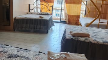 Quarto triplo econômico | Wi-Fi de cortesia, roupa de cama