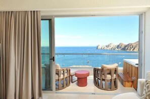 Relax on the balcony with a clear view of the sea and rocky coastline.