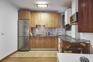 Fridge, microwave, coffee/tea maker, toaster