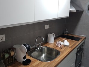 Fridge, oven, coffee/tea maker, cookware/dishes/utensils