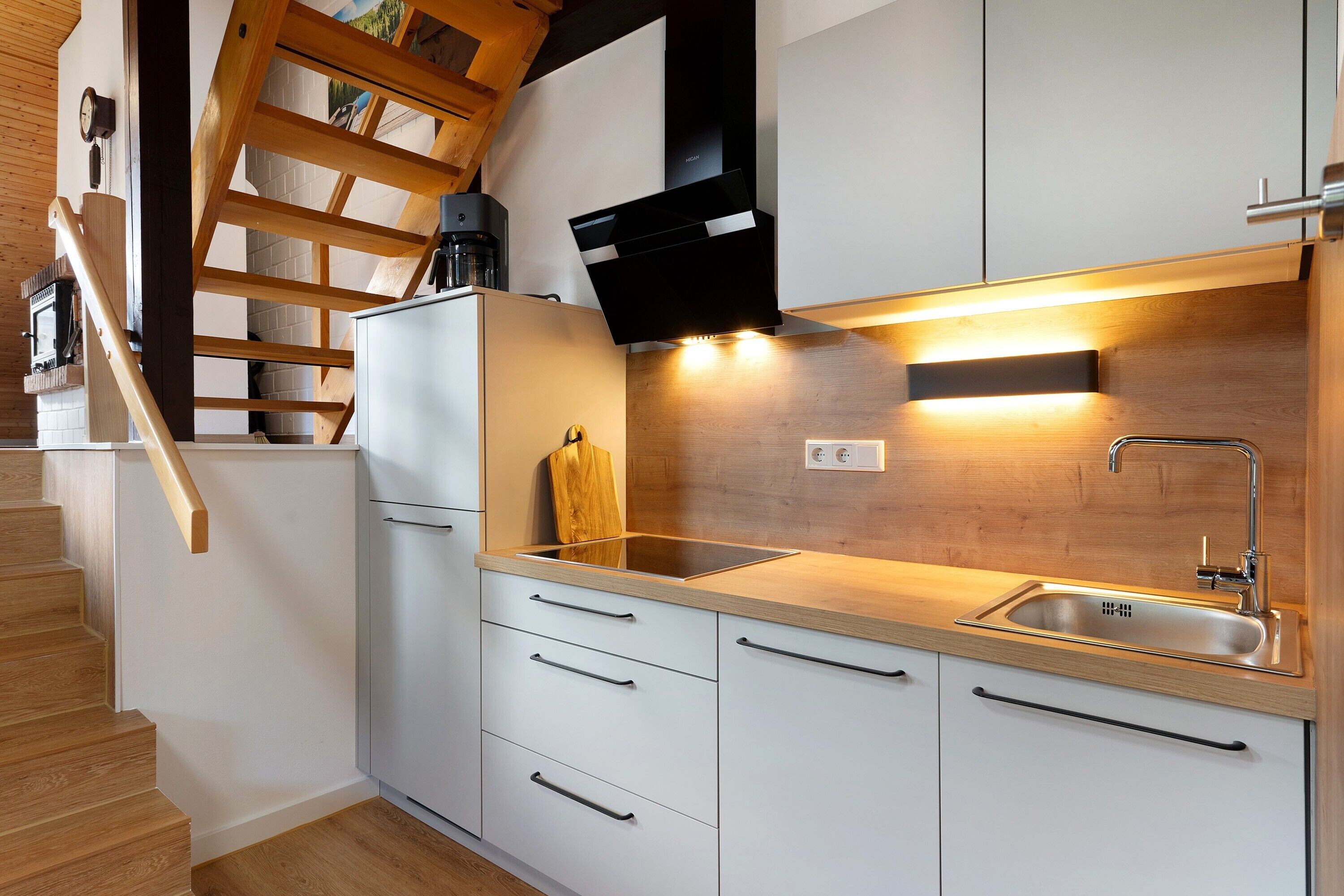 Fridge, stovetop, dishwasher, coffee/tea maker