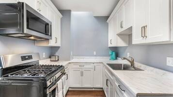 Fridge, microwave, stovetop, coffee/tea maker