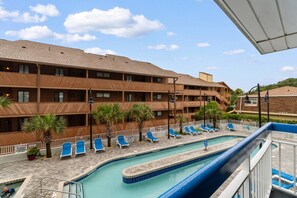 A hotel with a pool area, multiple balconies, and lounge chairs. - Oceanview, Pools, Hot tub, Indoor pool, 2 Beds (Myrtle Beach)