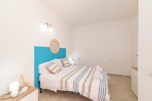 Family Apartment, 2 Bedrooms (Appartamento Rosmarino In The City) | 2 bedrooms, iron/ironing board, bed sheets