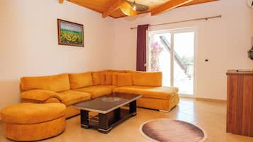 Family Studio, Balcony | Living area | 81-cm Smart TV with cable channels, heated floors