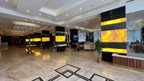 A spacious lobby with a marble floor, a reception desk, and seating areas. - Paradise Inn Jeddah (Jeddah)