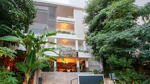 A multi-story building with a sign reading "AKABAN SUITE". - SAKABAN Suite (Siem Reap)