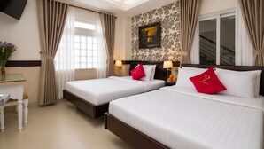 A hotel room with two beds, a desk, a TV, and a window with curtains. - Pink Suite Saigon Airport Hotel (Ho Chi Minh City)