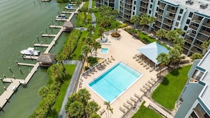A heated pool - Waterfront 1BR condo on Marco Island with pool, WiFi, and full kitchen. (Marco Island)