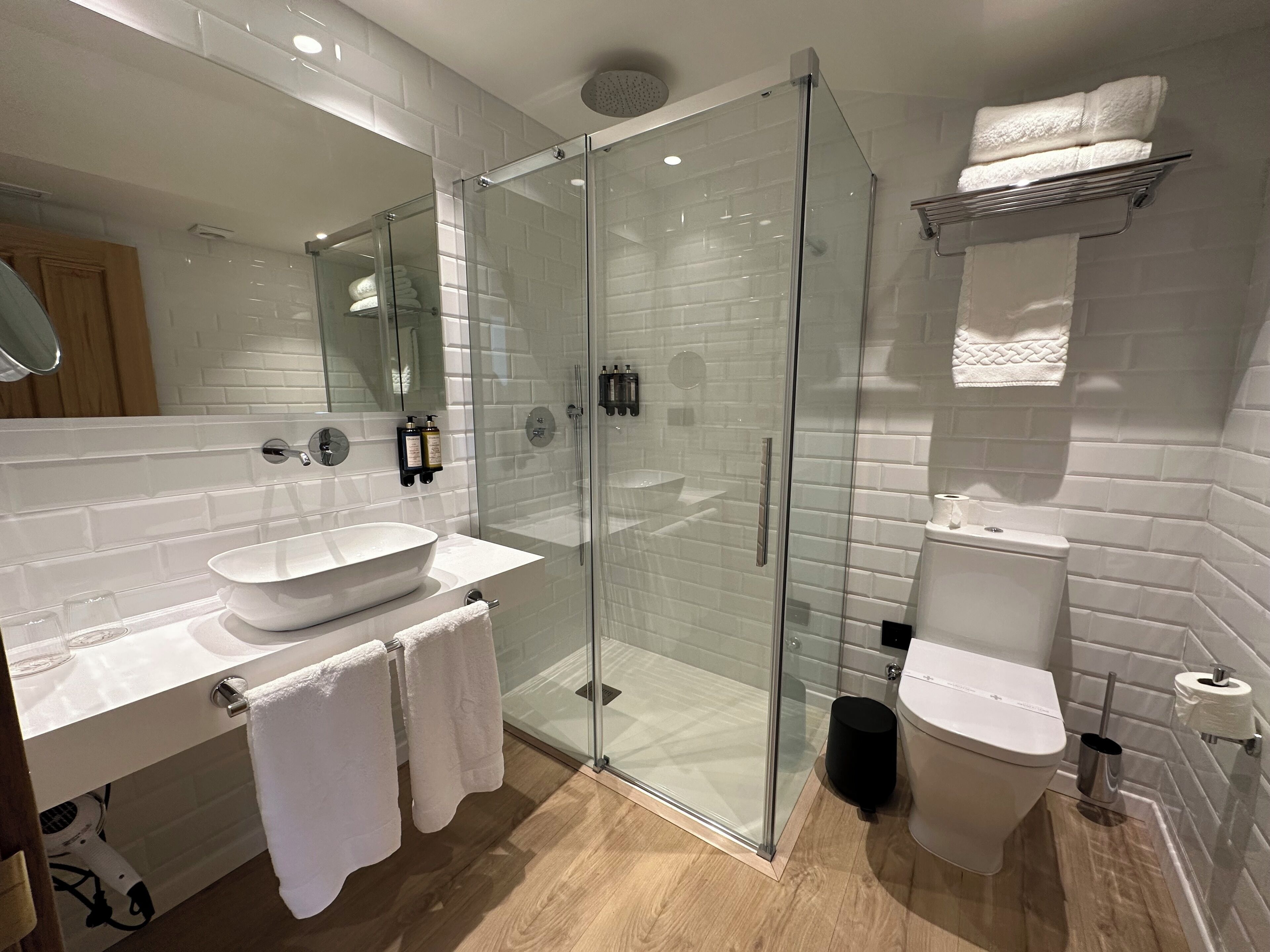 superior double room | bathroom | shower, rainfall showerhead, hair dryer, towels