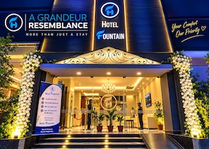 A hotel entrance with a grand facade, a welcoming sign, and a concierge desk. - Hotel Fountain (Dhaka)