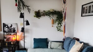 A modern living room with a sectional sofa, a glass coffee table, and a white furry rug. - 1 bedroom apt. of an Artist photographer close to Cannes Croisette (Cannes)